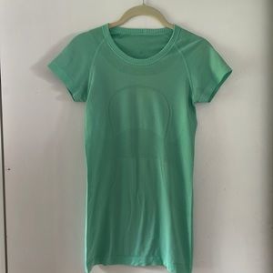 Small or extra small light jade green Lululemon top.